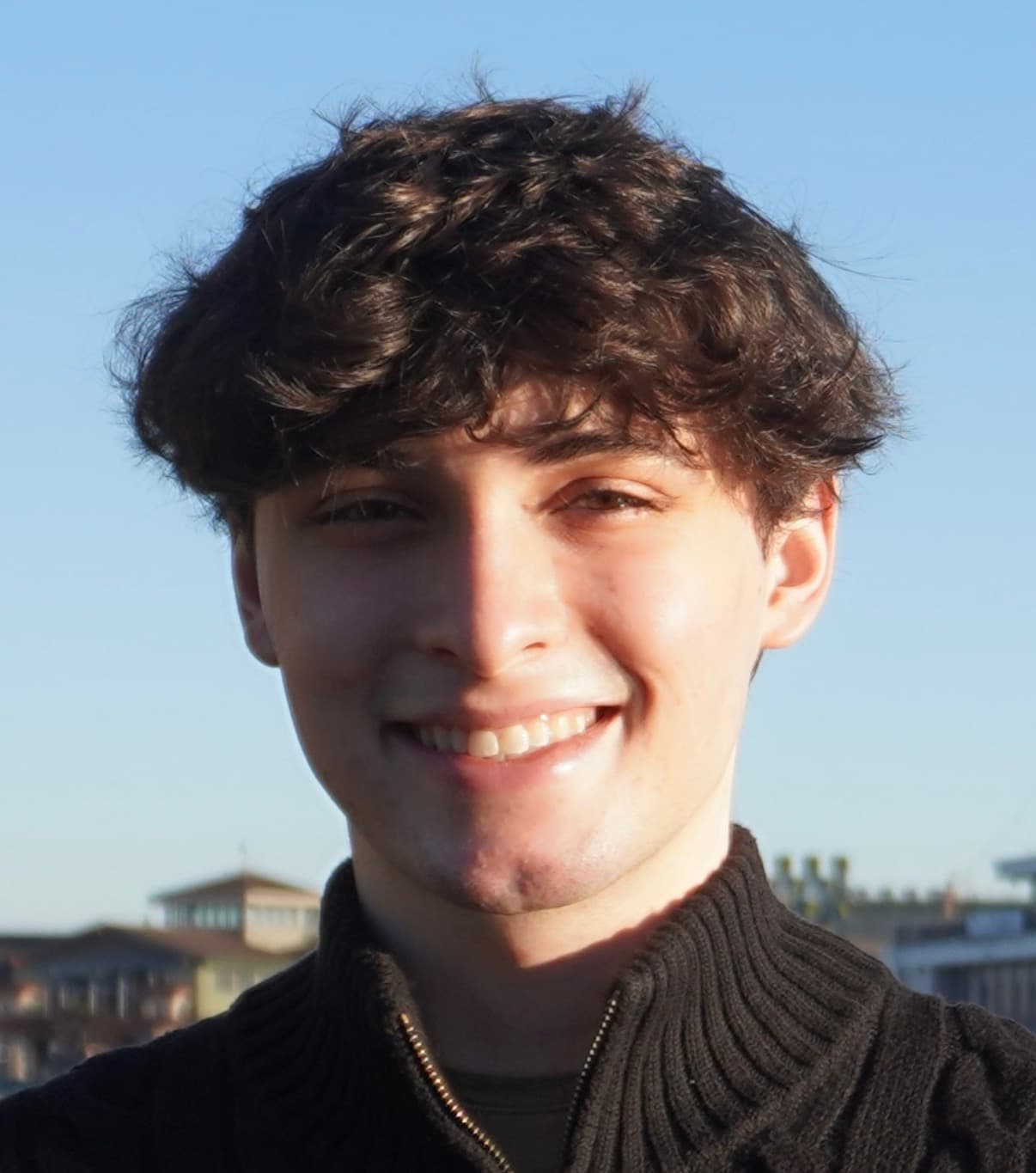Joey Zabaglo smiling outdoors